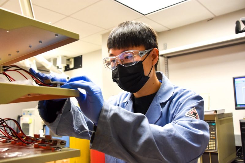 Lin lab student works on batteries.