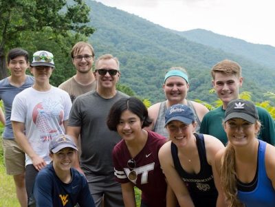 Picture of Moore research group hiked to the top of Sharp Top Mountain together as a summer activity.
